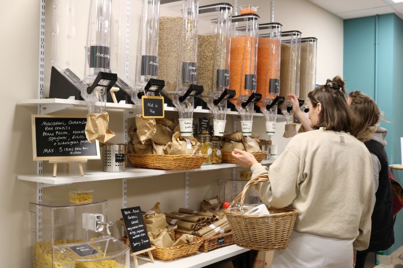 two students getting products in the pantry